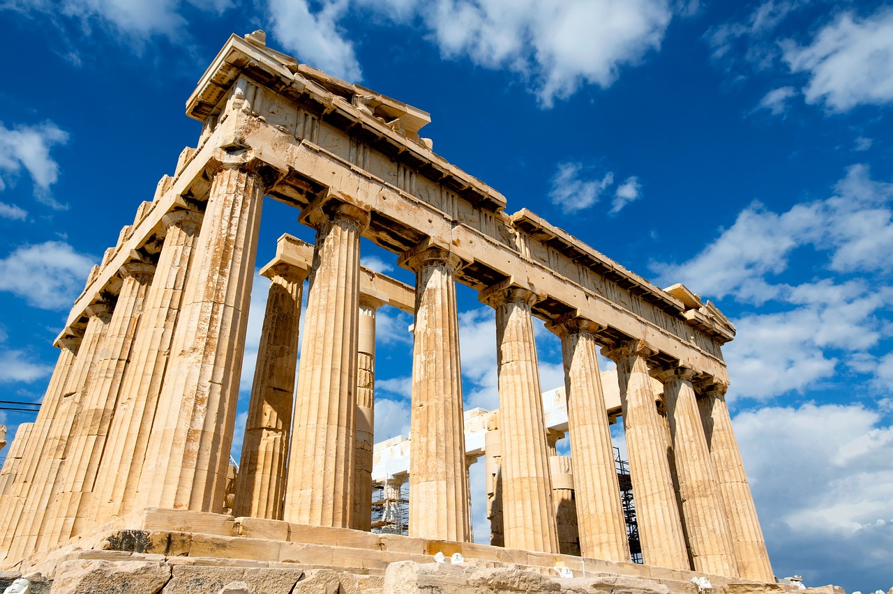 The Parthenon Temple in Athens, Greece, highlighting its grand columns and historical architecture set against a bright, sunny sky , study in Erurope | Geoedutech.